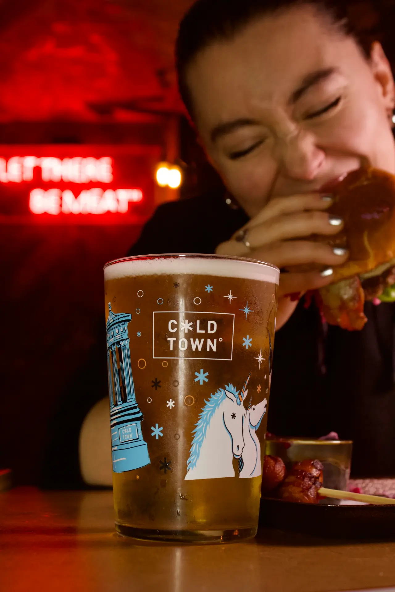 Guest biting into a burger